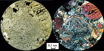 The meteorite under microscopic view (scale: 0.1 mm (1⁄250 in))