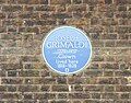 English Heritage blue plaque at Joseph Grimaldi's former home at 56 Exmouth Market, Islington