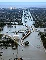 Image 39Devastation caused by Hurricane Katrina in New Orleans, Louisiana during 2005, shown here looking down on Interstate 10 at West End Boulevard towards Lake Pontchartrain. Over 1,800 people were confirmed dead with 705 still missing. It was the costliest Atlantic hurricane in history causing around $86 billion in damage. This photo shows flooded roadways as the United States Coast Guard conducted initial damage assessment overflights of New Orleans on Monday, August 29, 2005. The city flooded due primarily to the failure of the levee system. Many who remained in their homes had to swim for their lives, wade through deep water, or remain trapped in their attics or on their rooftops.