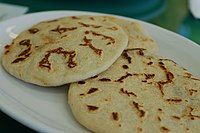 Pupusas revueltas stuffed with meat, beans and cheese