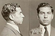 Black and white photograph, criminal mastermind Charles "Lucky" Luciano posing for mugshot