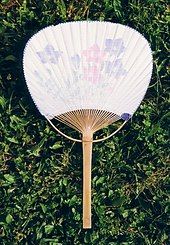 A white Eastern fan, with pink and purple flowers