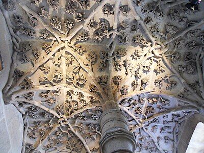 The sculpture at the top of the main stairway, with the intertwined emblems of Jean sans Peur and the House of Burgundy