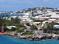 Residential suburb near the old St. George's Garrison, with "Town Cut Battery" or "Gate's Fort" on the shore of the Town Cut, and St. George's Town and its harbour in the background