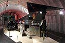 ☎∈ Rear view of ThrustSSC, with a panel removed to show one of the aluminium alloy wheels, at Coventry Transport Museum.