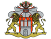 The coat of arms shows a white castle with three towers on red. The middle tower shows a cross on top and the castle has a closed gate. With a helmet with crest including three peacock feathers and six banners of the arms and a mantling are topping the coat of arms.On both sides are a lions.