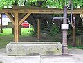 Saint George's Well before the thousand-year-old linden on the former marketplace pumps water from a depth of seven metres.