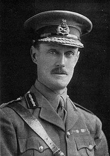 head and shoulders portrait of man in military uniform and hat