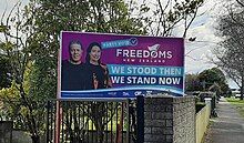 Photos of Brian Tamaki and Sue Grey on a large hoarding that says, "Party Vote Freedoms New Zealand. We stood then, we stand now".