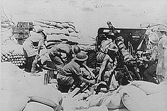 Indian Ordnance QF 18-pounder gun crew in action before capture of Keren