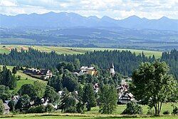 Village center with local Catholic church and Tatras