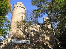 Outside of castle, with trees in front