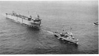 USS Oak Ridge (ARDM-1) under tow by USS Atakapa (ATF-149) arriving in Rota, Spain on 26 June 1964. US Navy photo #USN 1104547 by PH1 J.A. Herry USN