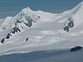 Helmet Peak and Devnya Valley from Zemen Knoll, with Vitosha Saddle in the background and Zlatograd Rock in the right foreground