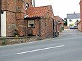 Extant pillbox at Acle, Norfolk (Grid reference TG4015310586), carefully blended with the adjacent building