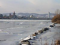 A look upstream from the Donauinsel in Vienna, Austria during an unusually cold winter (February 2006). A frozen Danube usually occurs just once or twice in a lifetime.