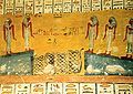 Fourth hour of the Book of the Gates from KV2, tomb of Rameses IV. Analysis: "the time is like a serpent, of which the nocturnal hours are born like goddesses. After its trip they are devoured again by the serpent. The blue triangles represent the water in the underworld".