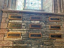 Memorial plaques for George Mackay Brown, Edwin Muir, John Mooney, Eric Linklater, Margaret Tait, J. Storer Clouston, Hugh Marwick, Robert Rendall, Stanley Cursiter in St Magnus Cathedral, Orkney