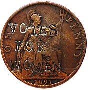 A defaced pre-decimal British penny with the words 'Votes For Women' stamped on it.