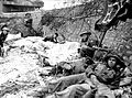 Canadian wounded await evacuation on Juno Beach, on D-Day