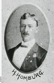 Head and shoulders of a man in formal dress with a bow tie, in an oval frame