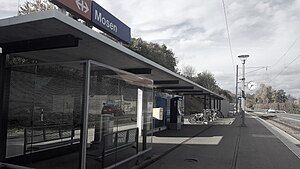 Single-tracked railway line with canopy-covered platform