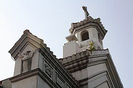 Roof details of church's façade, showing the small, decorative cupola at its apex