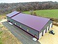 Image 11Post frame Barndominium with standing seam metal roof. Large garage on the front side and living space on the back end. (from List of house types)