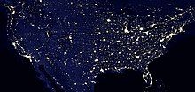 Nighttime satellite image of the contiguous United States showing light pollution in densely populated areas