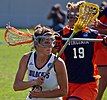 A Northwestern Wildcats women's lacrosse player in a game