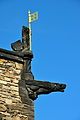 Gargoyle and the lion with the flag of England from the royal arms