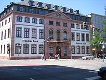 An inner-city baroque palace, white paint and red sandstone