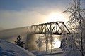 Mist rising from the Oulujoki river embraces the Vaalankurkku railway bridge in Finland, by TeVe