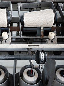 4. The paper strips are then spun into yarn.