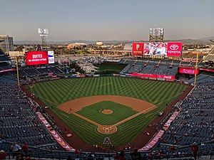 View of a baseball stadium, taken from the upper deck and looking out over the field from center field.