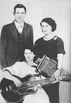 Carter (holding the autoharp) with the rest of the Carter Family in 1927