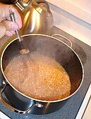 A gravy sauce thickens after flour has been added to melted fat. The gluten (protien) in the flour denatures, unfolding into long chains, which tangle with one another and make the sauce viscous.