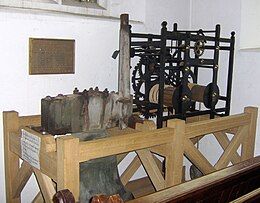 Wooden framework containing metal mechanical mechanism.