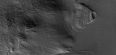 Close view of exhumed crater, as seen by HiRISE under HiWish program. This crater is and was under a set of dipping layers.