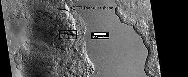 Close view from a previous image, as seen by HiRISE under HiWish program. The triangular shape of some depressions are noted. The area in the box is enlarged in following images.