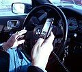 Image 59A New York City driver holding two phones (from Smartphone)