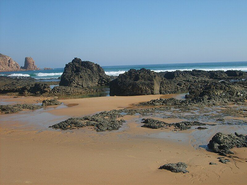 File:Capewoolbeachrocks.JPG