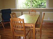 A wooden dining table and chairs