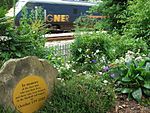 An InterCity 225 passes the memorial garden created next to the East Coast Main Line for the four people who died in the Hatfield rail crash