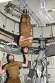 Carr "balances" Bill Pogue as a demonstration of zero-G.