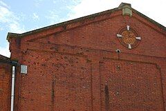 Machine gun fire left marks on the north side of the building (left of image).