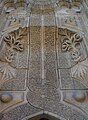 The highly ornamented stone facade of the entrance of the İnce Minareli Medrese