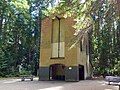 Abandoned brick structure surrounded by forest