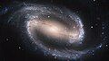 Image 9NGC 1300 is a barred spiral galaxy located roughly 69 million light-years away in the direction of the constellation Eridanus. In its core, the nucleus shows its own extraordinary and distinct "grand-design" spiral structure that is about 3,300 light-years long.