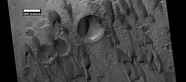 Dunes among craters, as seen by HiRISE under HiWish program. Some of these are barchans.